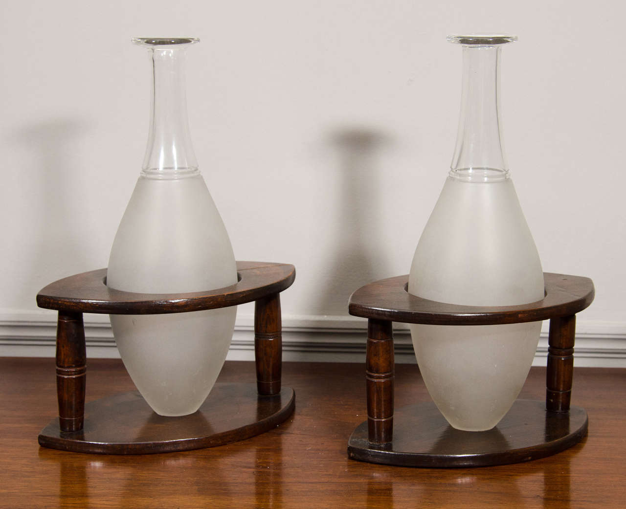 Pair of Hoggit decanters in wooden stands.