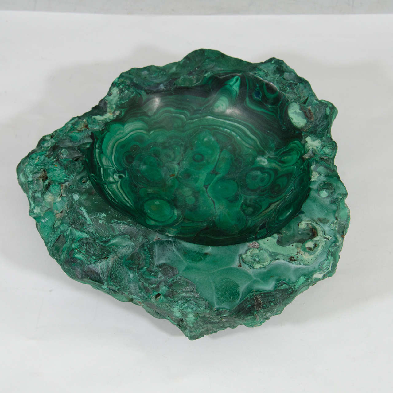 A vintage deep dish, ash tray, or bowl in malachite with green swirl detailing. Good vintage condition with age appropriate wear.