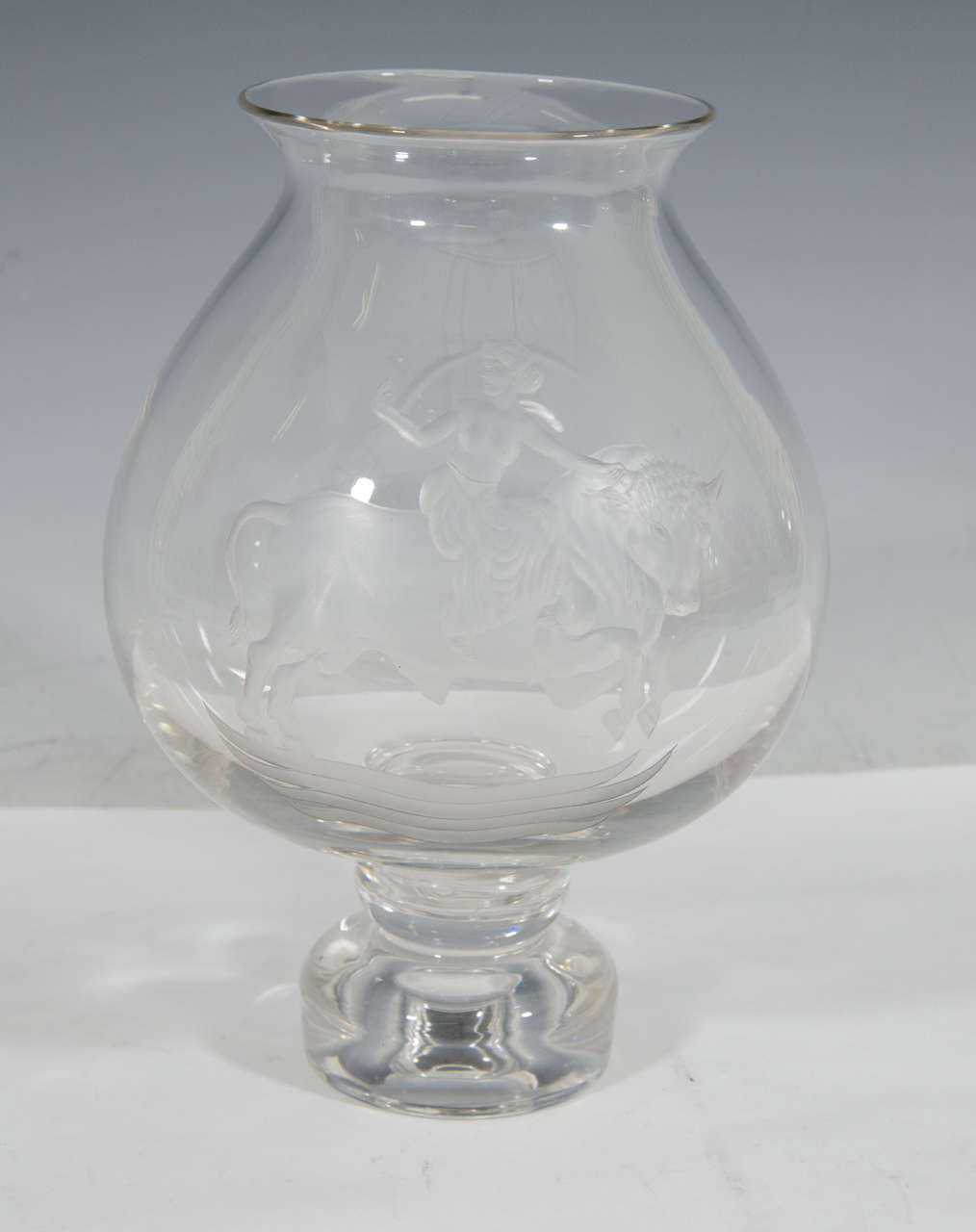 A vintage urn form glass vase with lead crystal pedestal base and acid etched figure of a semi-nude Europa and the bull. Numbered 413. Good vintage condition with age appropriate wear.