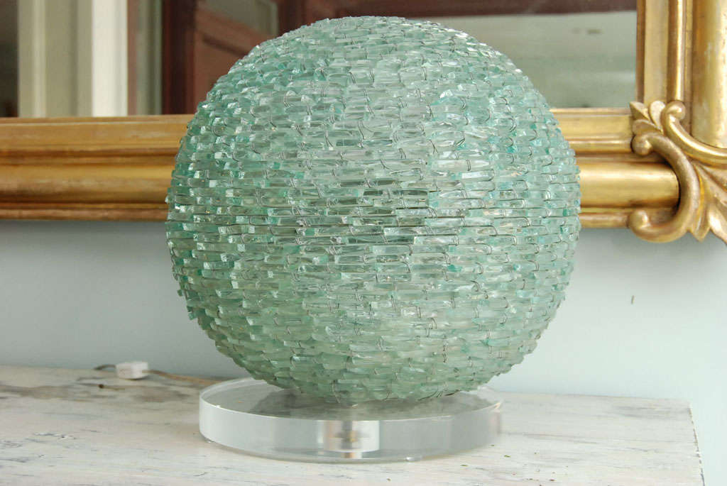 Spherical lamp created from pieces of car windshields on lucite base