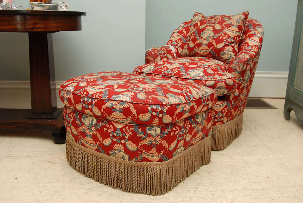 Victorian-style chintz-upholstered chair and ottoman from the Estate of Dominick<br />
Dunne.  Needs re-upholstery.  Measurements are chair and ottoman together.