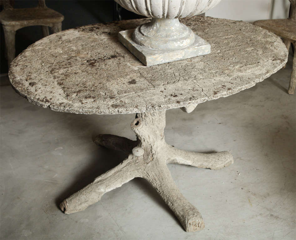 Faux Bois Garden table with some lichen on the top.  Note the little mushroom on the base of the table.