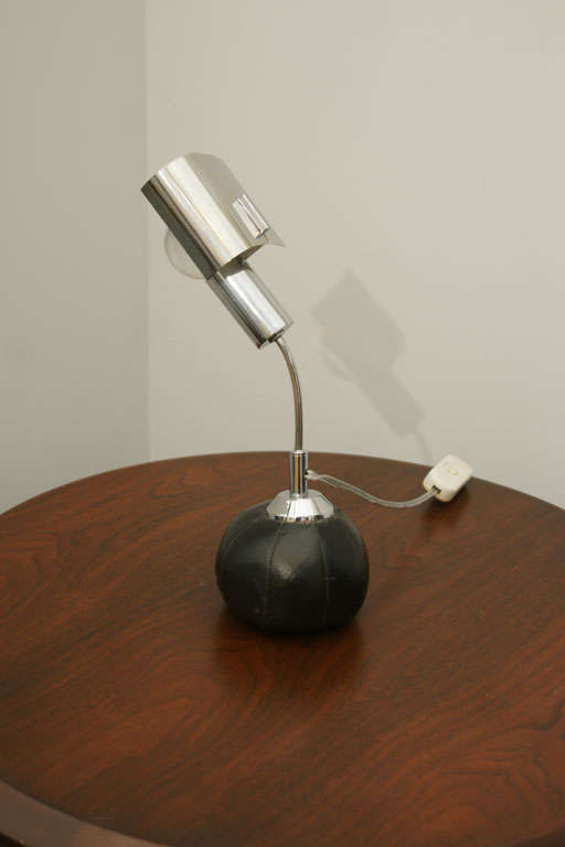 Italian Adjustable Table Lamp by Angelo Brotto<br />
Stainless Steel Arm Connected to Leather and Metal Base