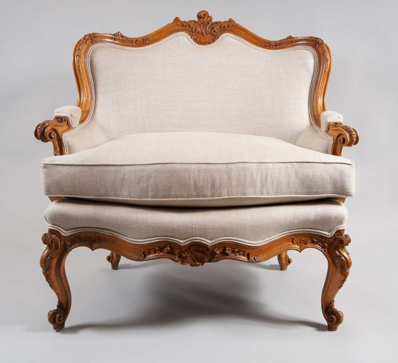 Oversized upholstered armchair.
Recently upholstered in French linen.