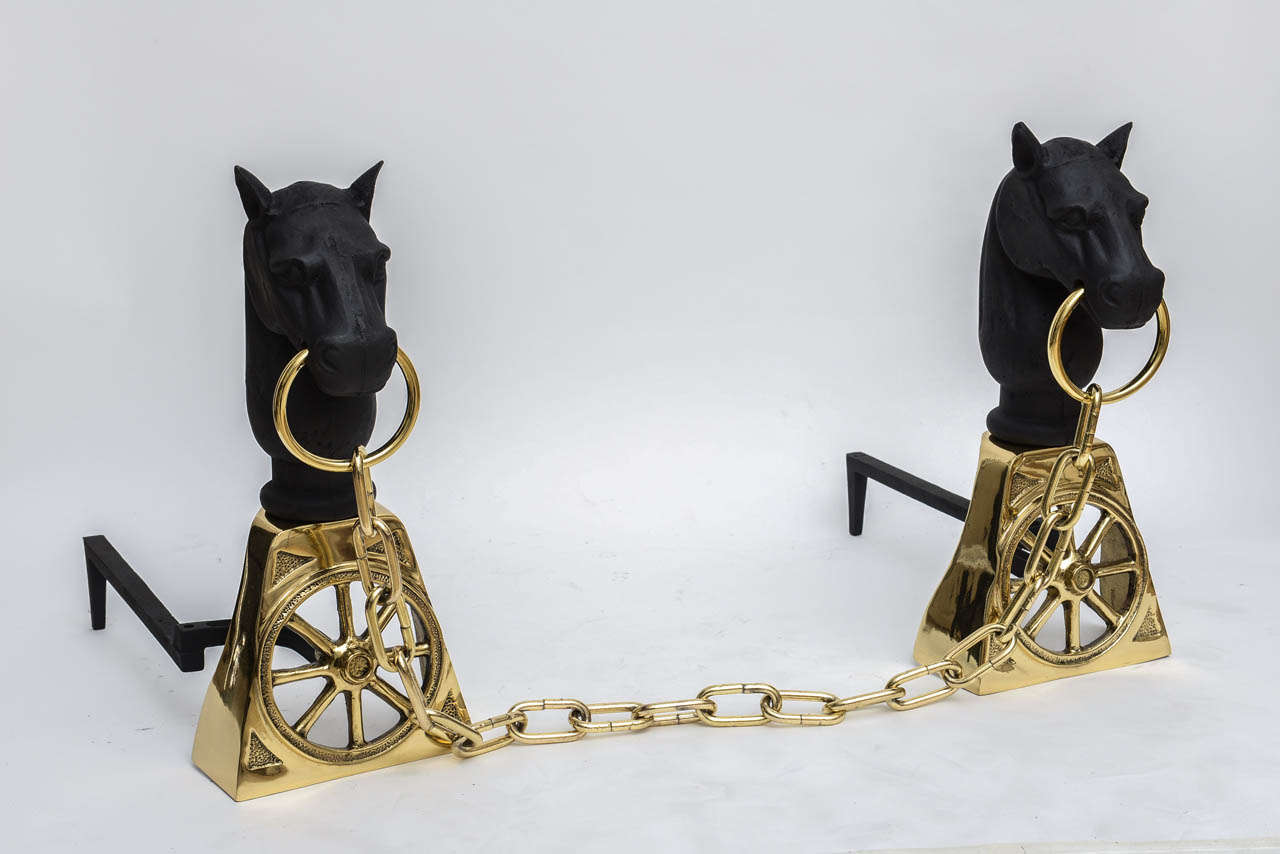 Stunning pair of iron and brass horse head andirons, made in Japan. Chain measures 31