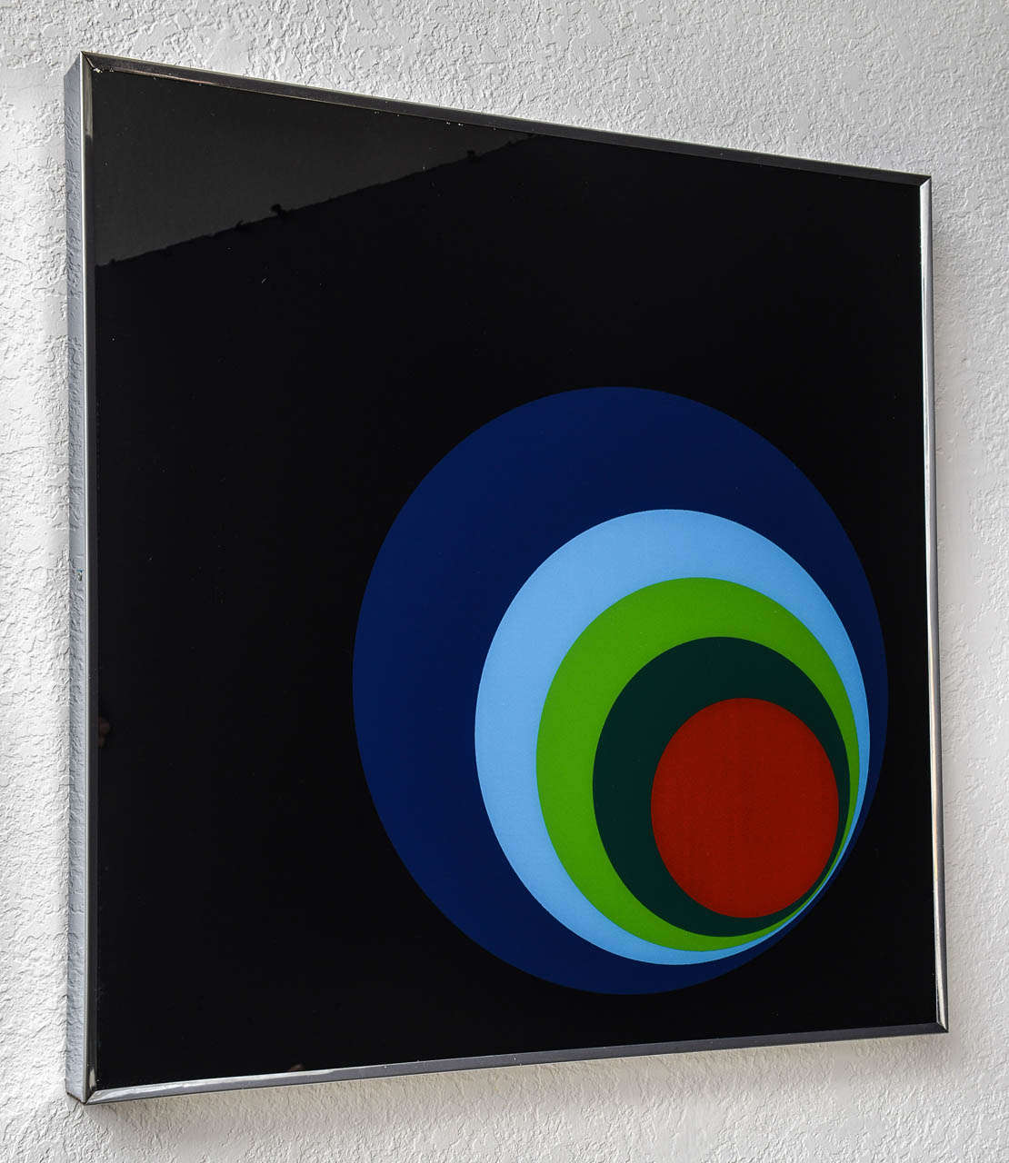 Mid Century reverse painted wall art with an assymetrical bullseye and chrome frame.

Please feel free to contact us directly for a shipping quote or any additional information by clicking 