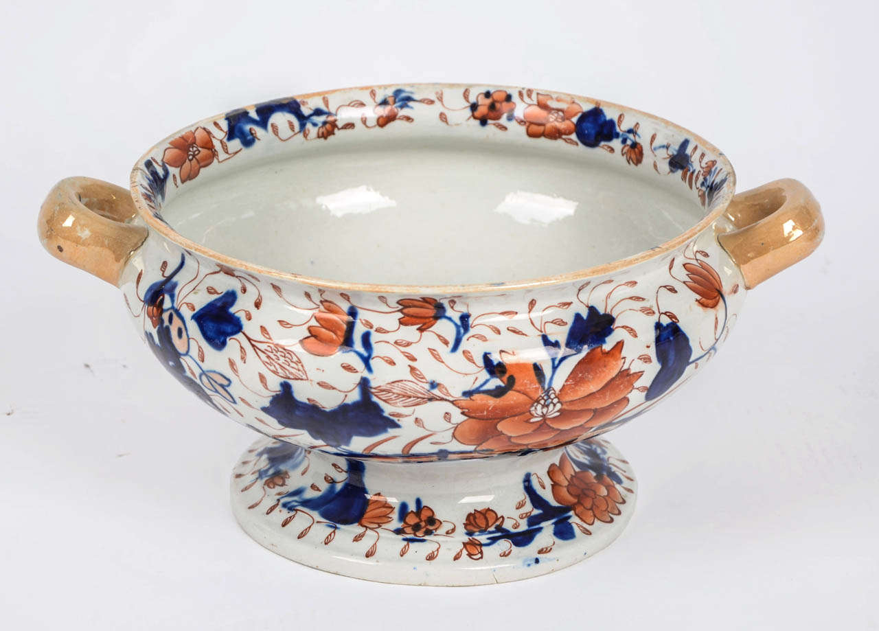 This is a rare and substantial Ironstone BOWL which I attribute to MASONS

This large open pedestal bowl is hand decorated in rich enamels using a brilliant cobalt blue, burnt orange and light blue in various shades. The loop handles and rim are