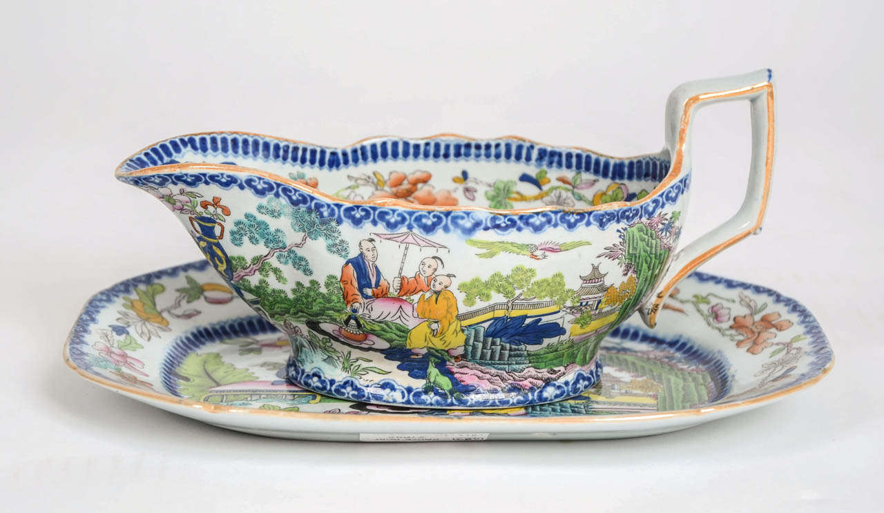 This Ironstone pottery sauce boat and Stand was produced by the Mason's factory at Lane Delph, Staffordshire, England.

Early Mason's Sauce boats are rare, particularly with a matching stand and in this sought after Chinoiserie pattern.

This is one