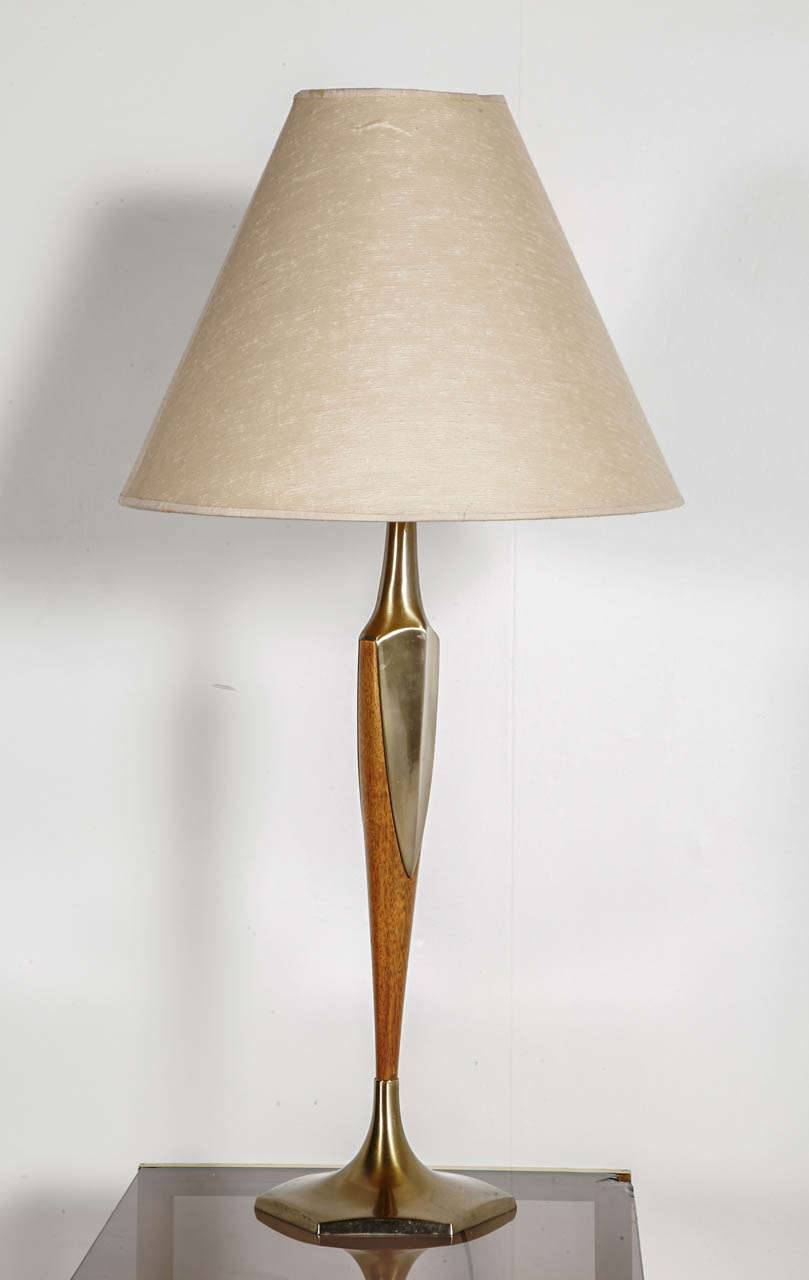 Very elegant gilded bronze and wood table lamp. Wired for European use. Wiring in good condition. Visible satin on the shade.