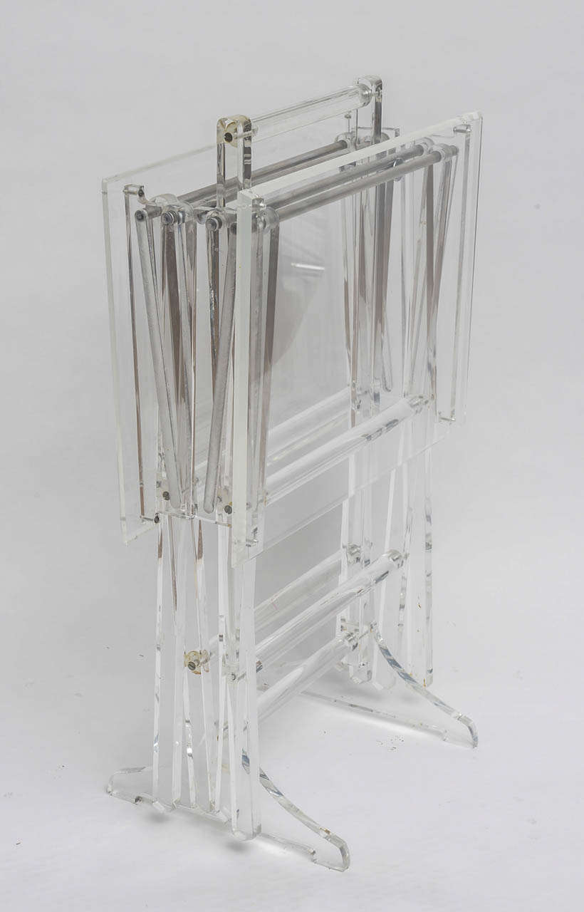 Fantastic lucite folding tables with handled caddy. Perfect for all spaces as they are virtually invisible. Table specs: Length : 20;  Width: 15;  Height: 25