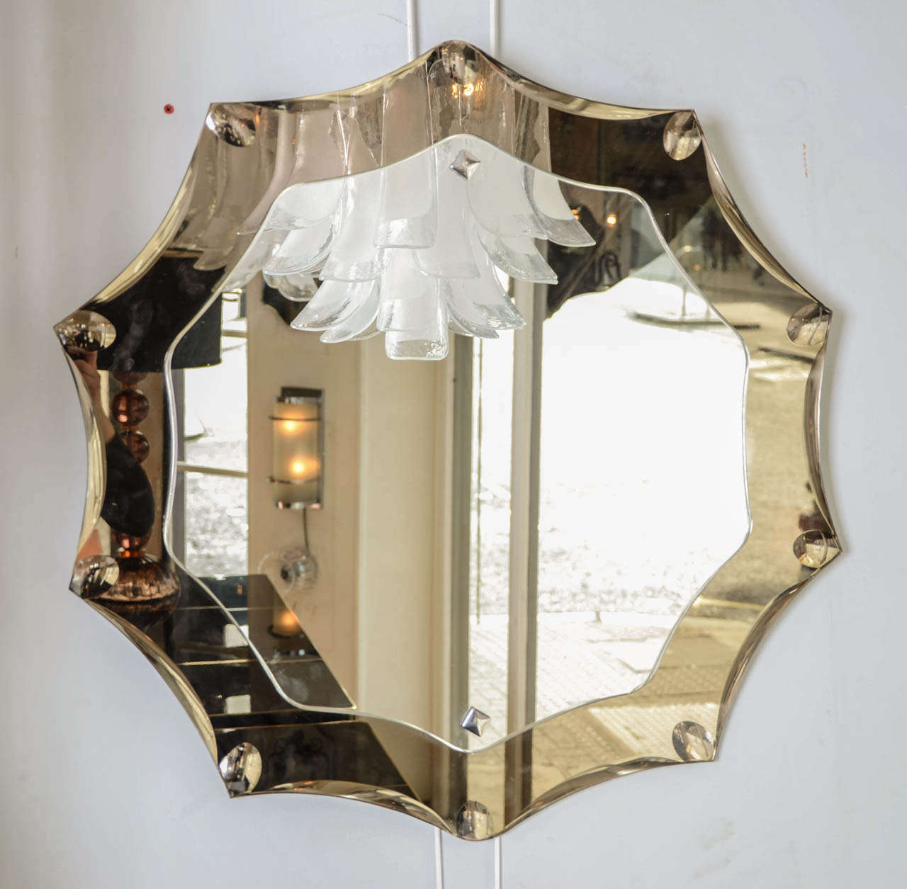 Elegant 1950s Italian Crystal Arte 'Star' mirror with smokey mirror surround. Ten point stars dotted with small concave effect detail.