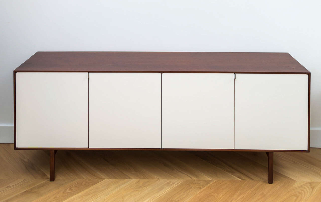 Beautifully restored Florence Knoll walnut credenza with stainless steel hardware.