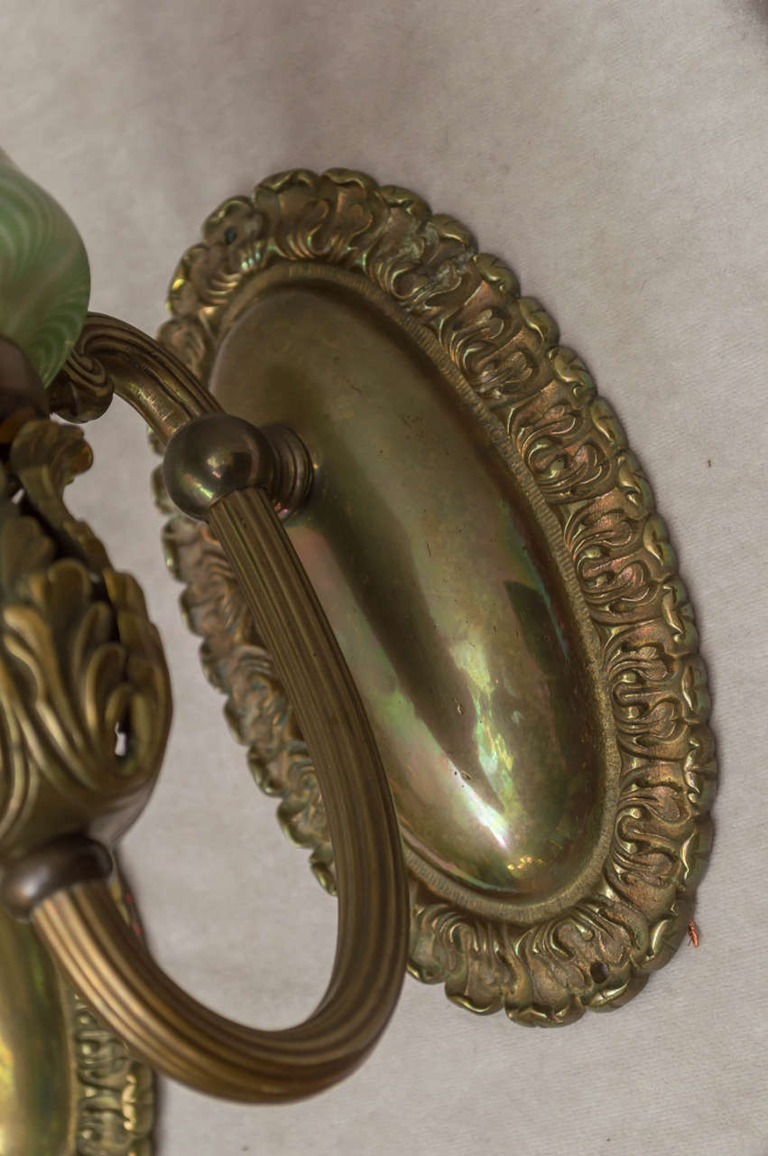Cast Pair of Bronze Sconces with Art Glass Shades
