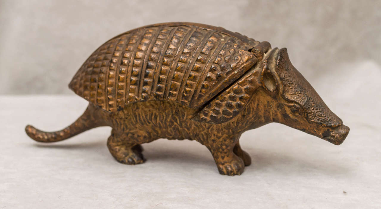 We have sold many bronzes over the years and I can't remember ever offering a figure of an armadillo. We believe this is Austrian, circa 1920. The armadillo's back lifts up, and reveals a double inkwell. It was missing the two ink receptacles and we