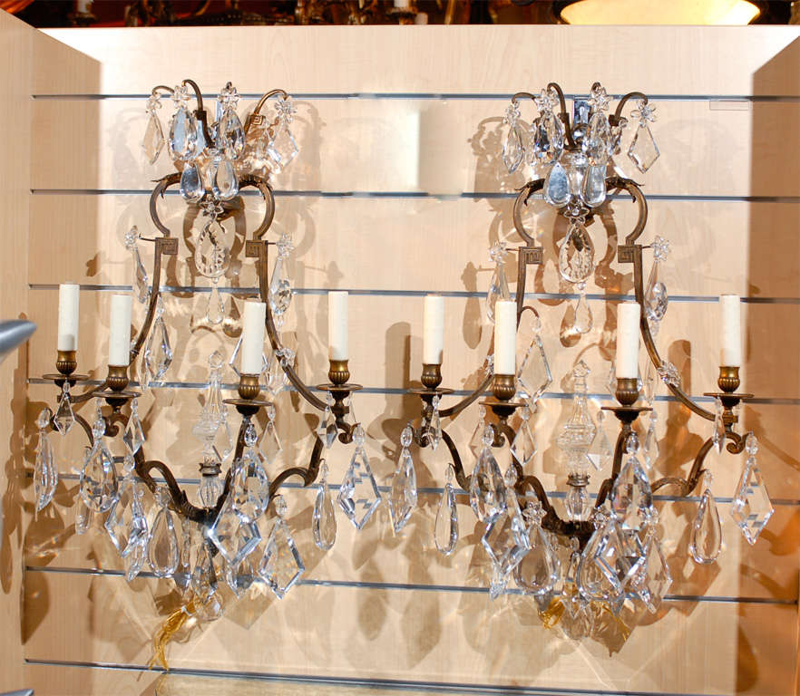 Pair of gilt bronze and crystal sconces by Baccarat