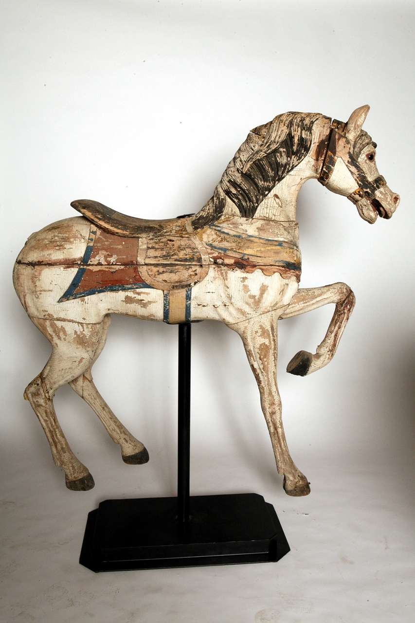 1920's wood carousel horse, believed to be from the Glendale Park Carosel that was located in Nashville.  Wonderful aged surface, and paint decoration.  Some stabilization repairs have been made.  The original tail is gone, and we have displayed the