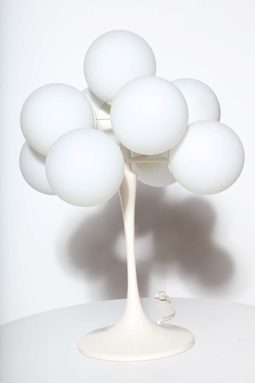 E. R. Nele White Nine Orb Tulip Table Lamp. Featuring a warm Off-White cast aluminium tulip base with nine threaded White frosted glass globes. Classic. Sculptural. Collectible. Statement lighting. Often mistaken for a Max Bill design. With Made in