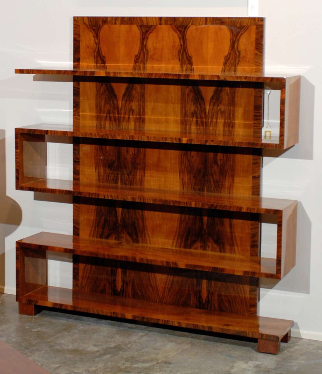 5 shelf walnut veneer bookcase with tall back.