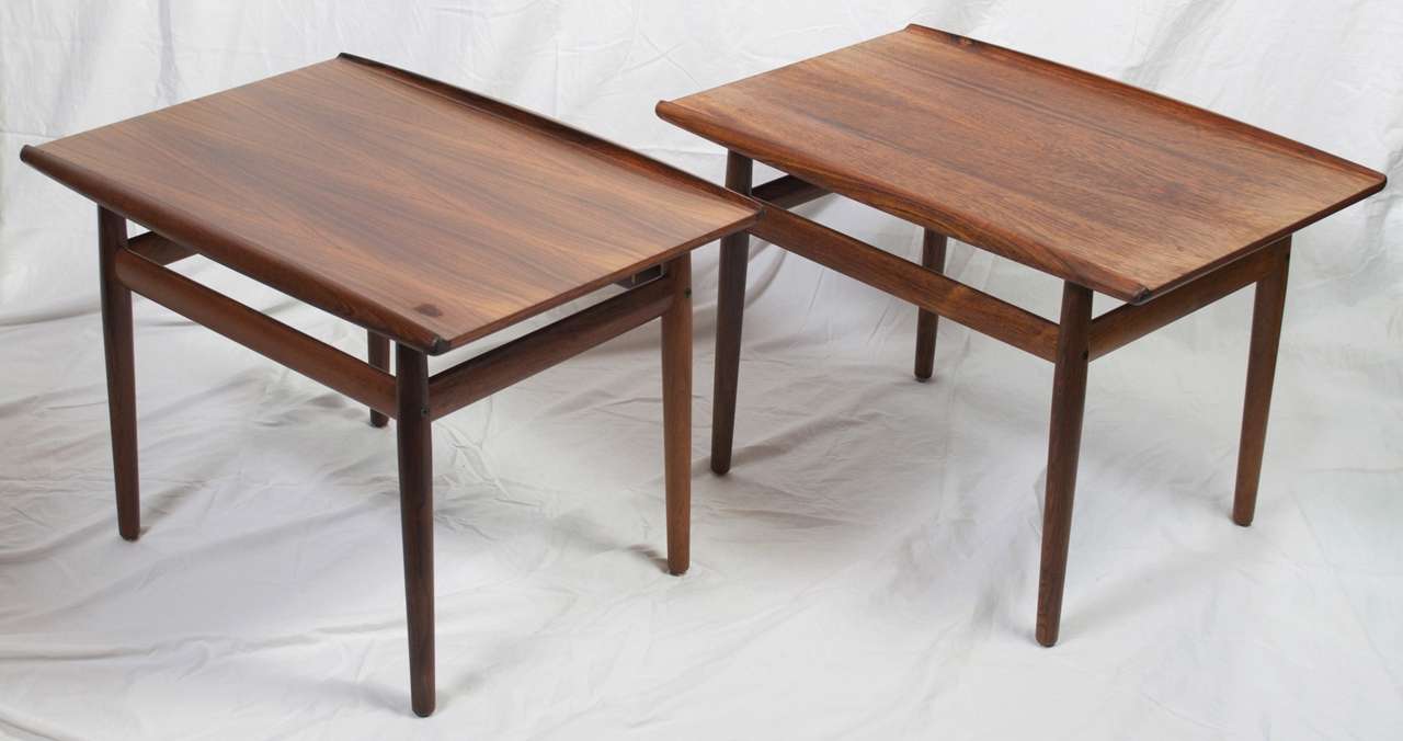 A gorgeous pair of end tables, with carved lip edges in the rare Rosewood. Designed by Greta Jalk c.1960's