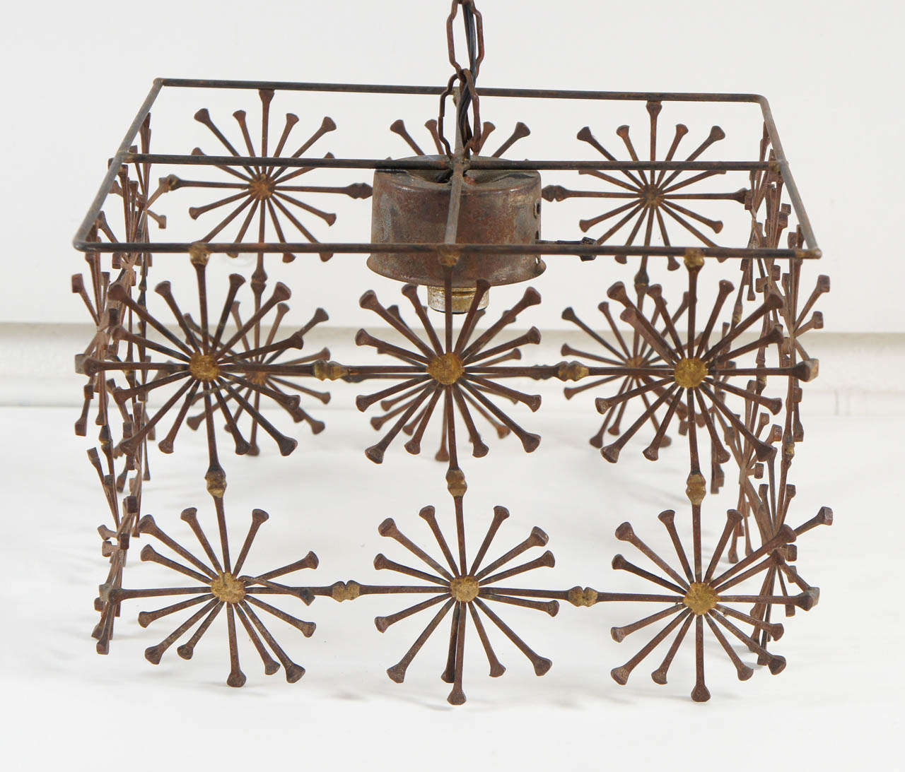 American A Boxed Iron Chandelier with Sunburst Detail