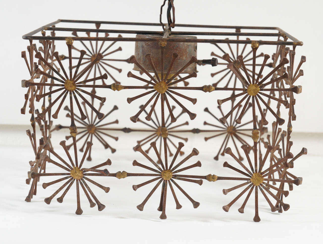 A Boxed Iron Chandelier with Sunburst Detail In Good Condition In Hudson, NY