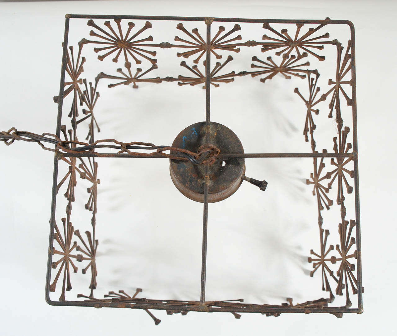 A Boxed Iron Chandelier with Sunburst Detail 5