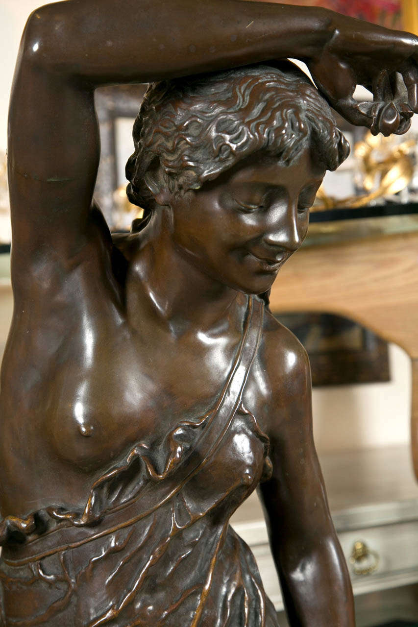 Palace sized antique bronze sculpture of  young girl.
