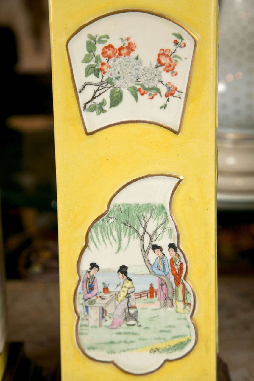 Beautiful pair of yellow porcelain Chinese lamps with white painted panels of nature scenes.