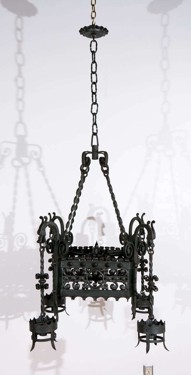 Italian chandelier with dragon detail and finely wrought chain. Newly wired with four standard sockets, each of which can take up to a 125 watt bulb.