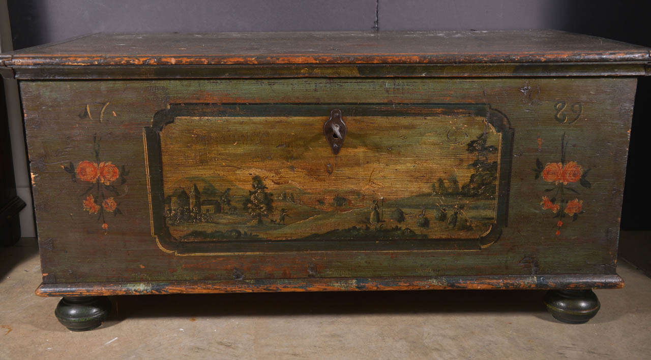 18th century painted trunk.  Original hardware and original muted paint with a date of 1789 and wonderful key.