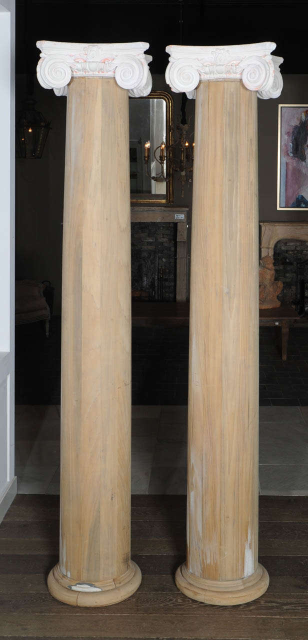 19th century, paint stripped. 
Nice set of decorative pinewood columns, ready to paint.

There are 4 columns on the pictures, but there are only 2 available.