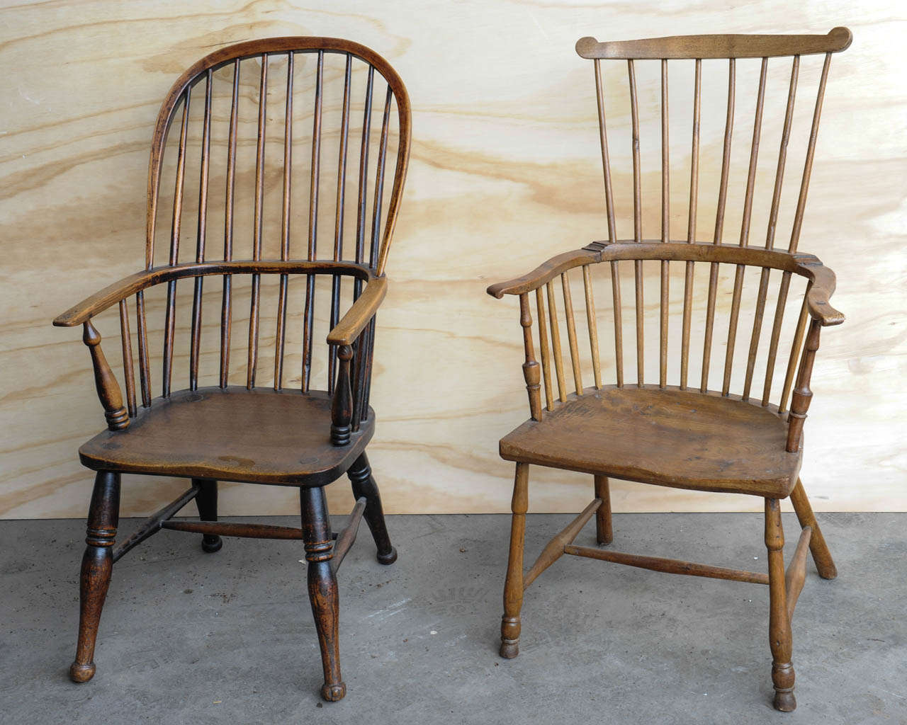 A 19th century English elm sack-back Windsor Armchair (left in the image)