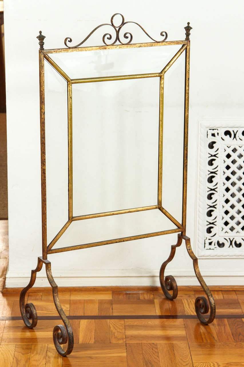 Very rare late 18th century French fireplace screen with original gold finish and original beveled glass.