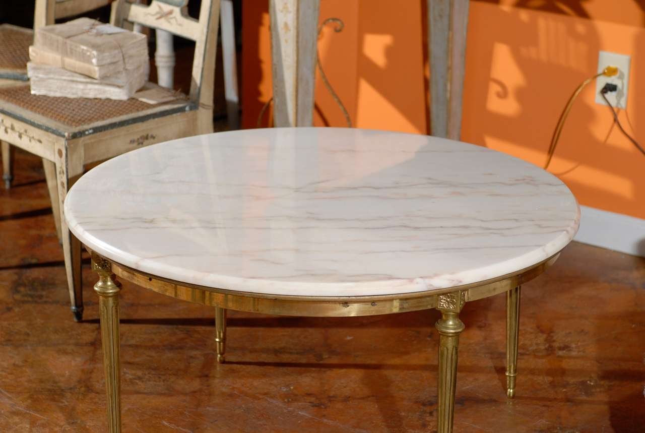 French round marble and brass coffee table.

To see more items from Foxglove Antiques, please visit our website: www.foxgloveantiques.com