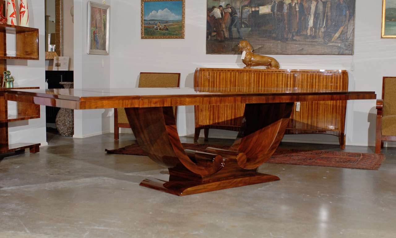 Incredible 20th Century Art Deco Walnut Dining Table with Arched Base
87.75 x 42.25 x 30.5 without leaves ( 121.75 with both leaves in)
