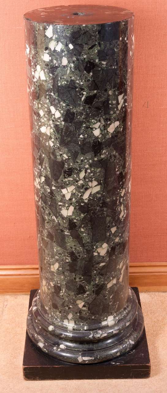 A Victorian period columnar Pedestal Stand of variegated green Scagliola on a square ebonised base. 