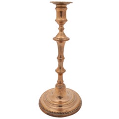 A good early George III period bell metal candlestick 