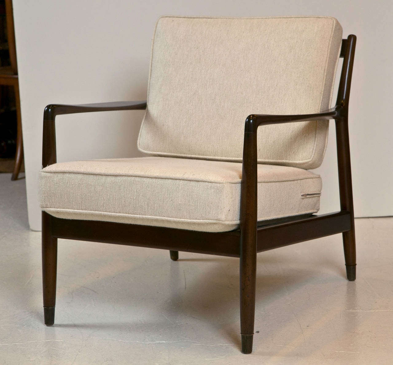 Mid-1960's lounge chair by Dux of Sweden.  Newly refinished walnut frame & new cushion & upholstery.  Brass capped feet.