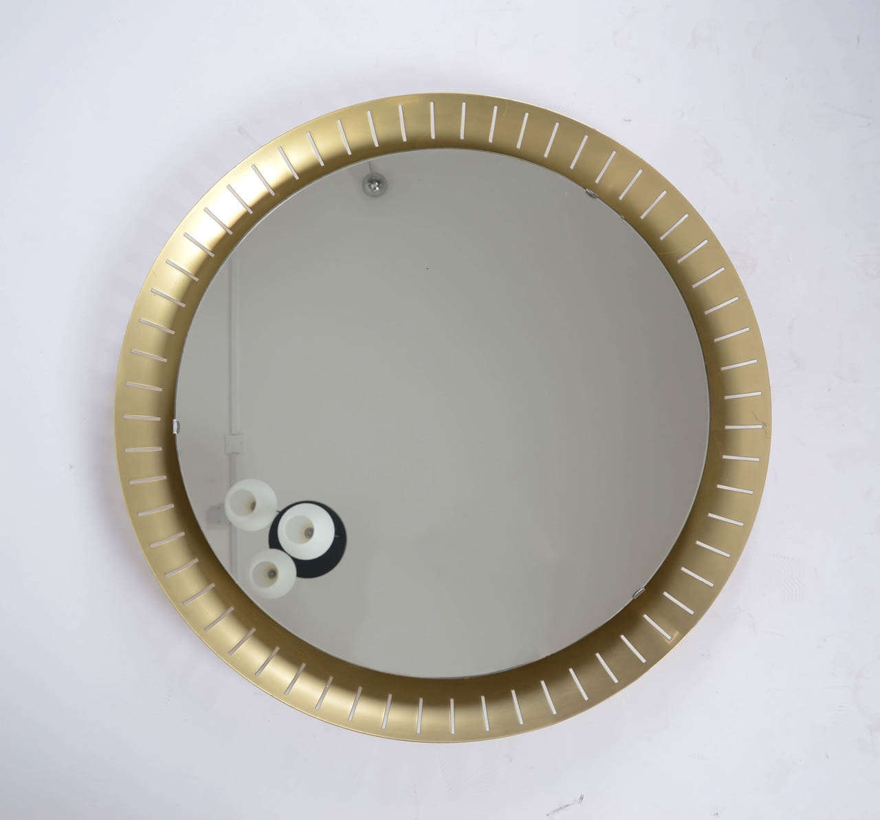 1960's Stilnovo round golded alluminium frame with round mirrored glass and a circle neon light behind the mirror.
