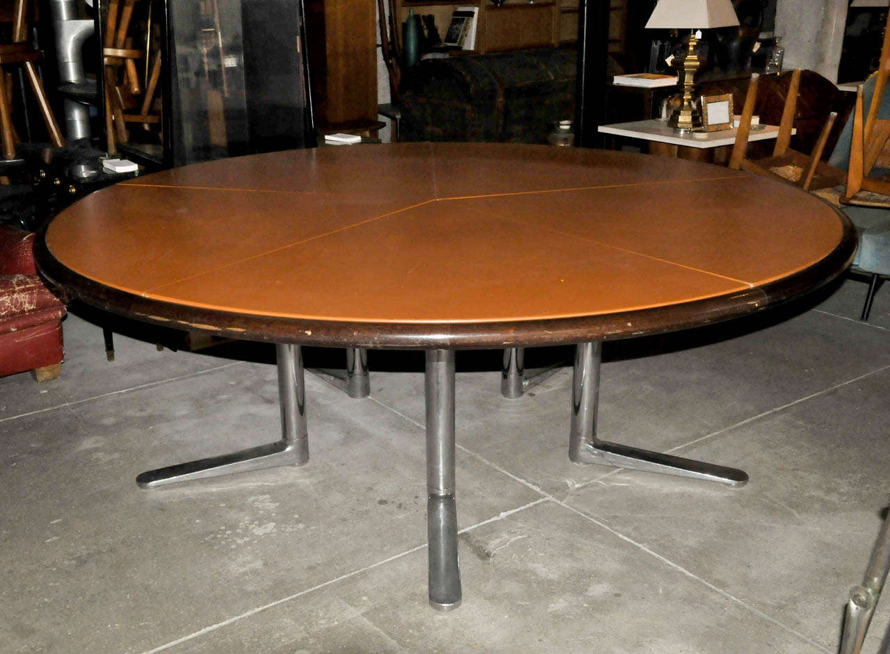 Large 1970's table with a tainted oak and tan leather top and a cast aluminium feet by Warren Platner. Marks on the leather and on the feet. Good condition. Normal wear consistent with age and use.