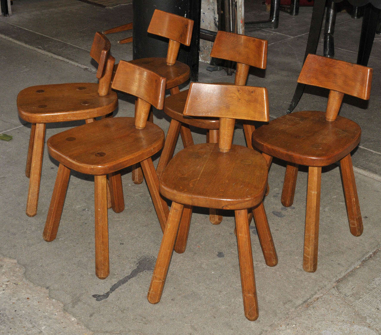 Set of six 1960's solid oak chairs. Some scratches and some wear. Good condition. Normal wear consistent with age and use.