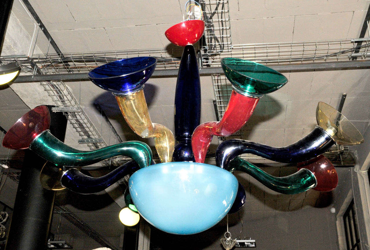 1990's Italian chandelier. Eight mixed color glass arms. VEART Edition. Wired for European use. Good condition. Normal wear consistent with age and use.