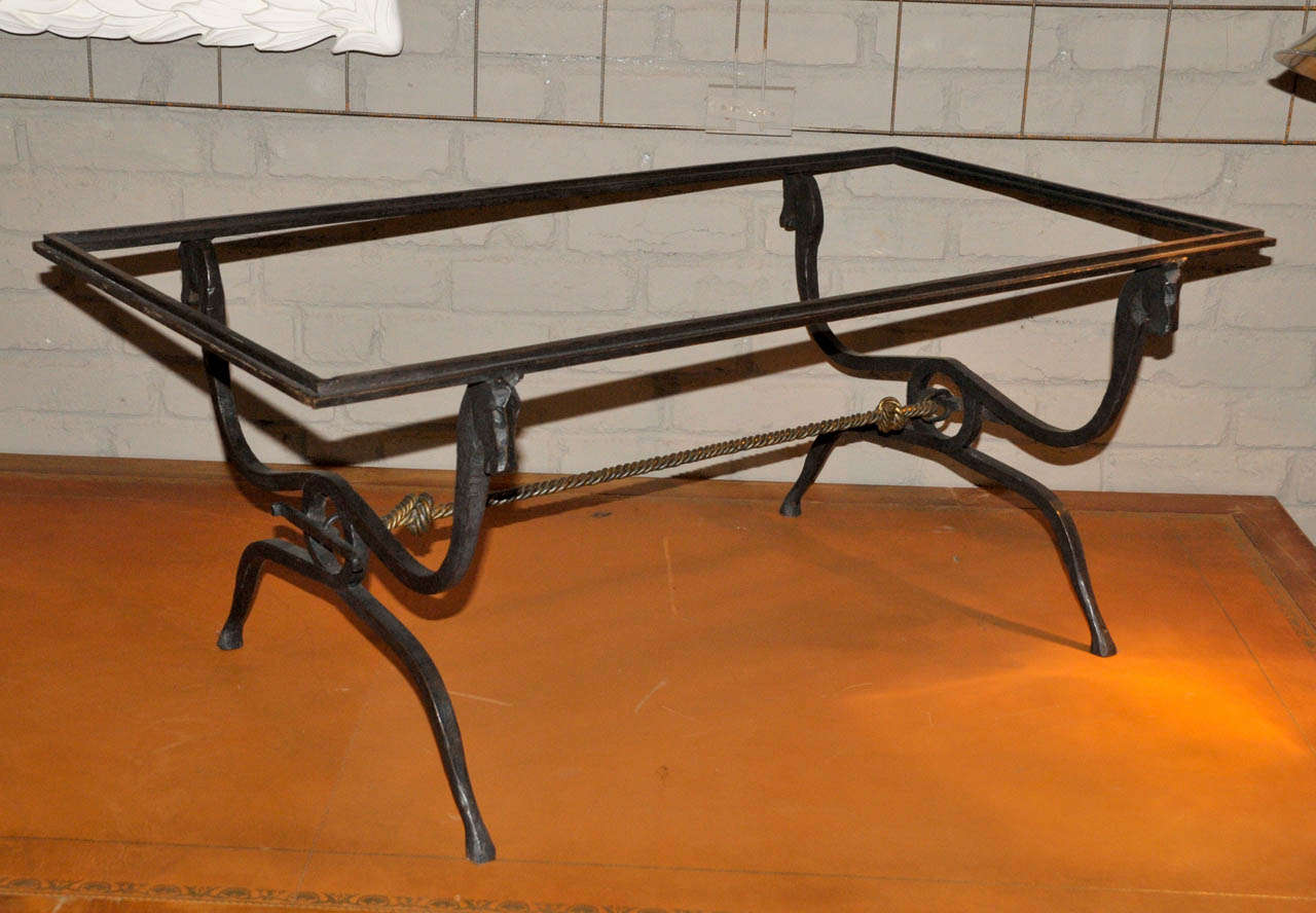 1940's coffee table in black patinated and gilded wrought iron attributed to Jean-Charles Moreux. Glass top is missing. Good condition. Normal wear consistent with age and use.