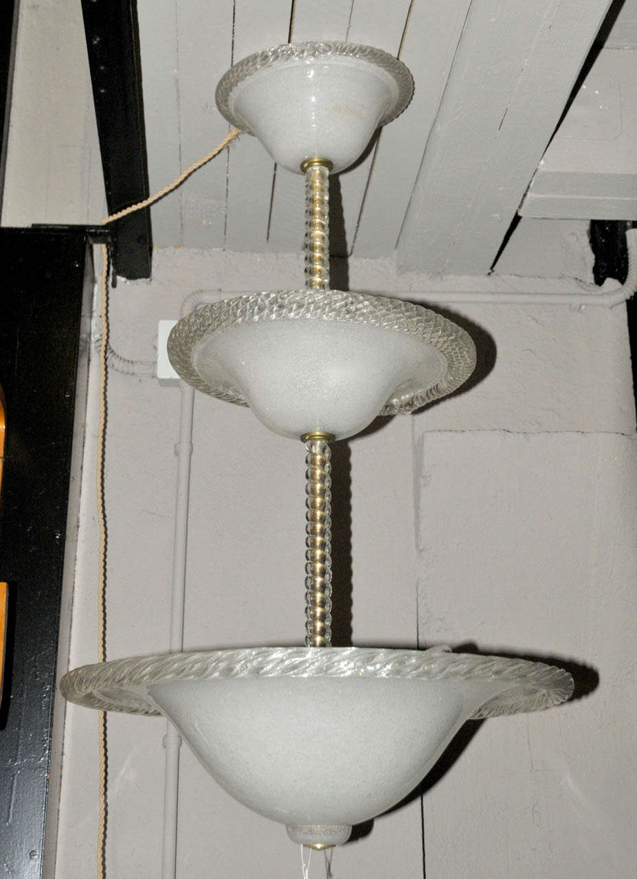 1930's Italian chandelier in Murano glass. Two lights in the upper dome and three lights in the lower one. Wired for European use. Very good condition. Normal wear consistent with age and use.