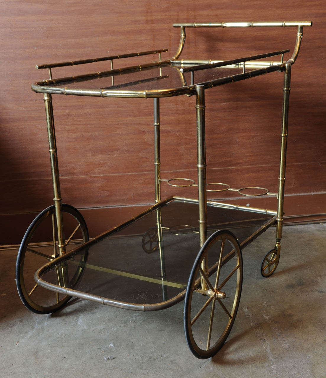 Wonderful bar cart tea trolley made of copper plated bamboo and smokes glass tops