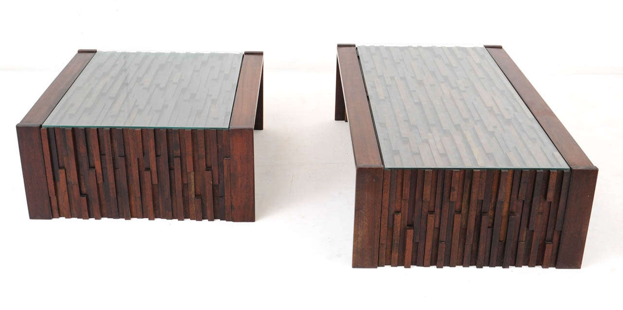 Beautifully patinated brutalist style originally signed pair of Jacaranda wood
folding tables by Brazilian designer Percival Lafer. The small table measures 75cm x 77cm x 35cm. Both tables have the original 1960's glass top.