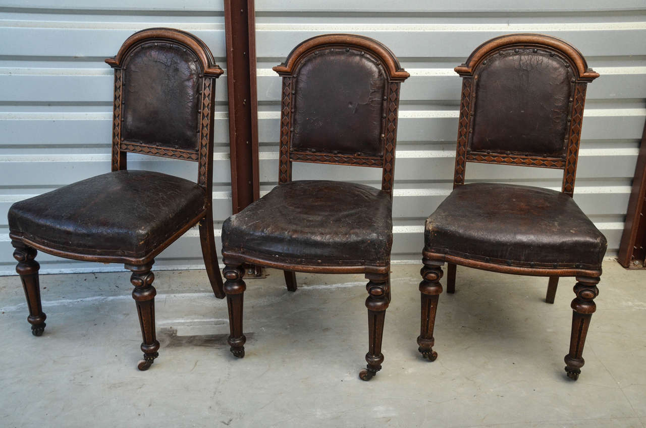 6 Victorian English Oak Arch Top Dining Chairs With Leather Upholstery. The Chairs Backs Have A Moulded Arched Top With A Diamond Incised  Pattern On Sides & Bottom. The Front Legs Have A Rounded Turning Below Which Is Incised Fluting , Ending In