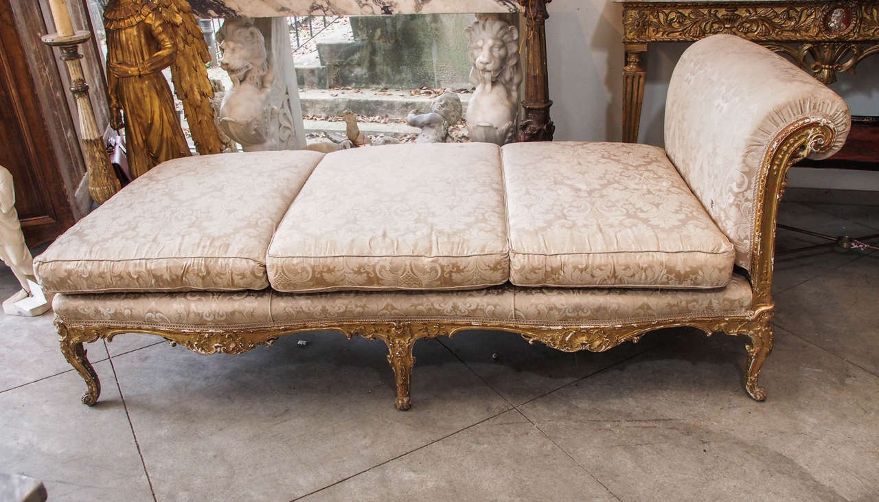 Beautifully carved and impressive giltwood chaise.