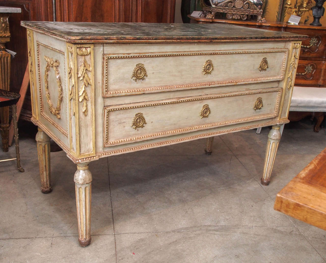 18th century painted, gilded and carved Italian commode.