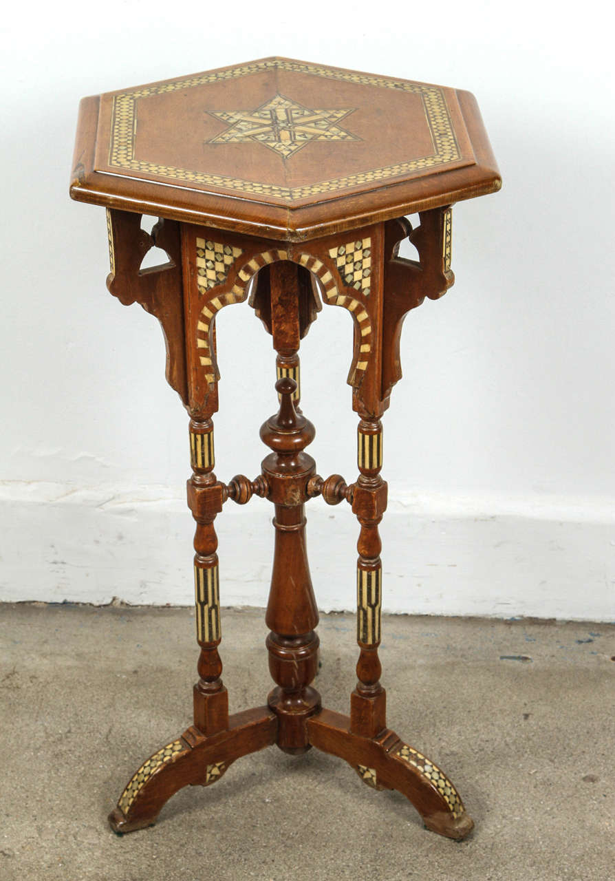 Moorish Spanish hexagonal side table.
Great looking accent side Syrian Moorish table in hexagonal shape with a star inlaid in mother-of-pearl.
Sides and legs are intricately inlaid in geometrical design in ebony and bone.
Very nice one of a kind